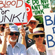 Anti-funk demonstrators protest George Clinton's plan to drop Da Bomb on Baghdad.